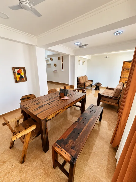 Wooden dining table and seating inside the property