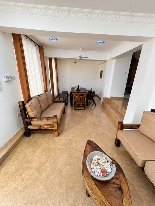 Another view of the indoor sitting and dining area
